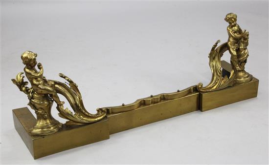 A 19th century Continental ormolu fender, W.3ft 7in.